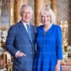 The King and The Queen, in the Blue Drawing Room at Buckingham Palace.
