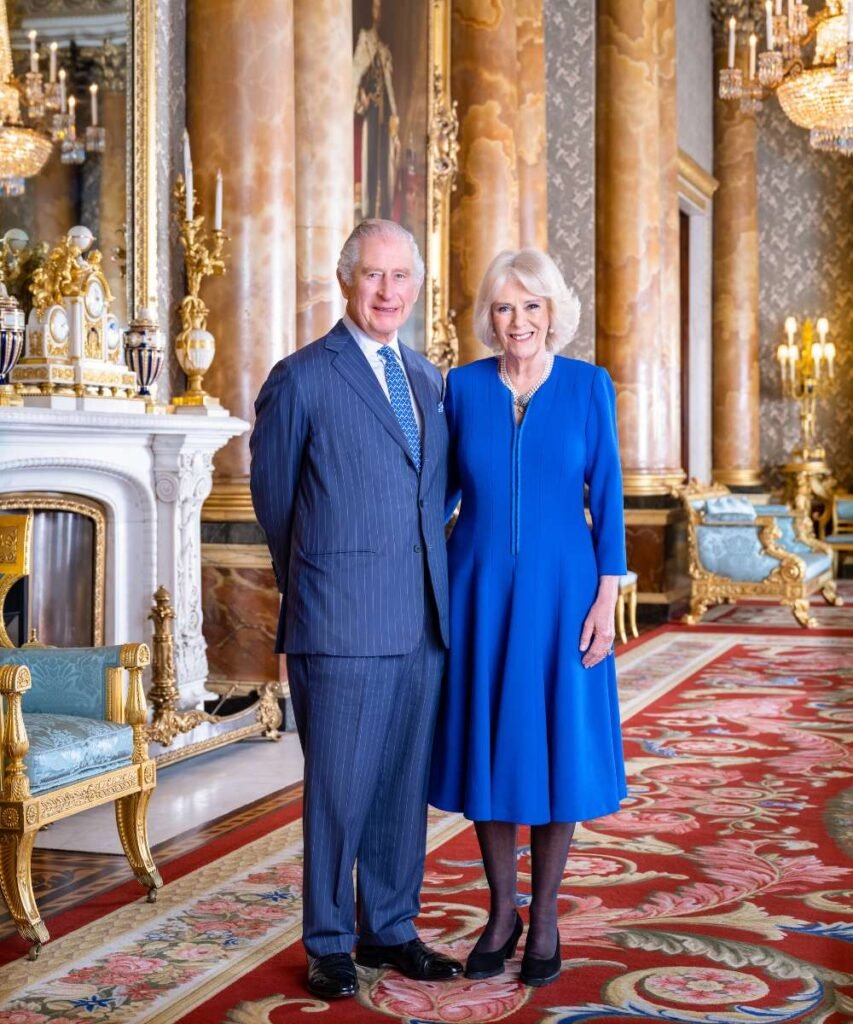 The King and The Queen, photographed in the Blue Drawing Room at Buckingham Palace.