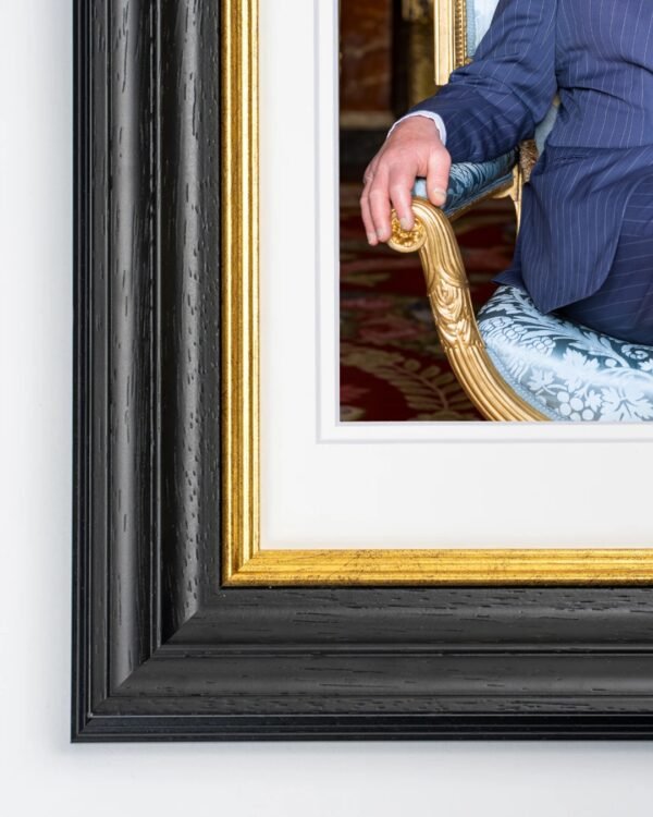 Windsor Framed Print of His Majesty The King seated in the Blue Drawing Room at Buckingham Palace.