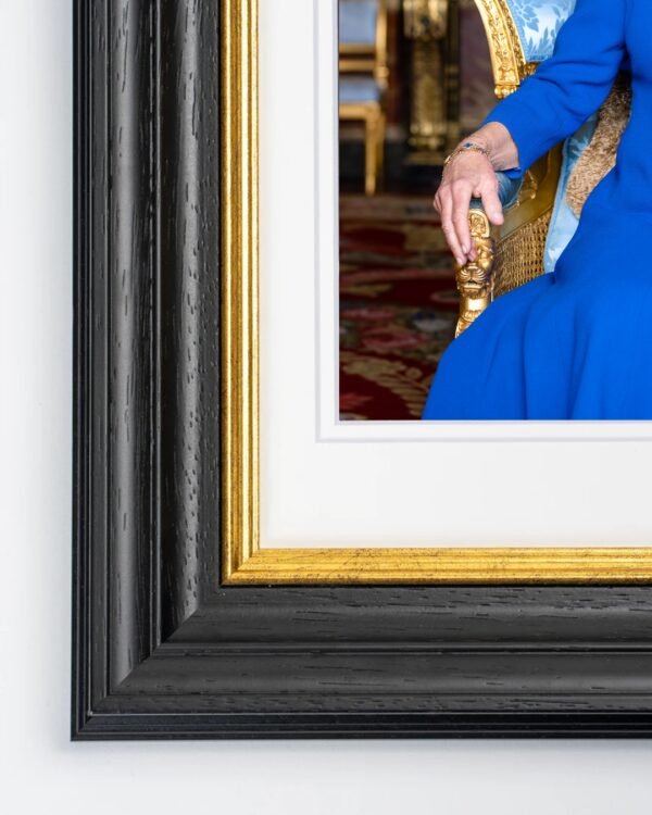 Windsor Framed Print of Her Majesty The Queen seated in the Blue Drawing Room at Buckingham Palace.